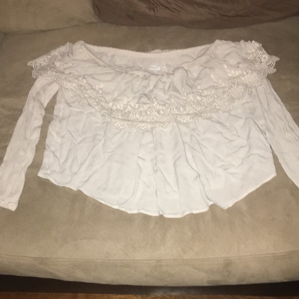 Off the shoulder top. Small flaw right sleeve